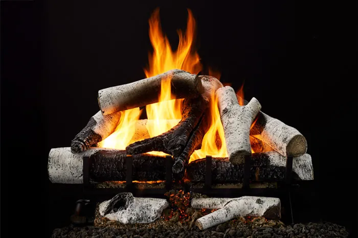 Grand Birch 3-Tier Remote Control Gas Log Set with hand-painted white birch logs, glowing ember bed, and vivid flames against a black background.