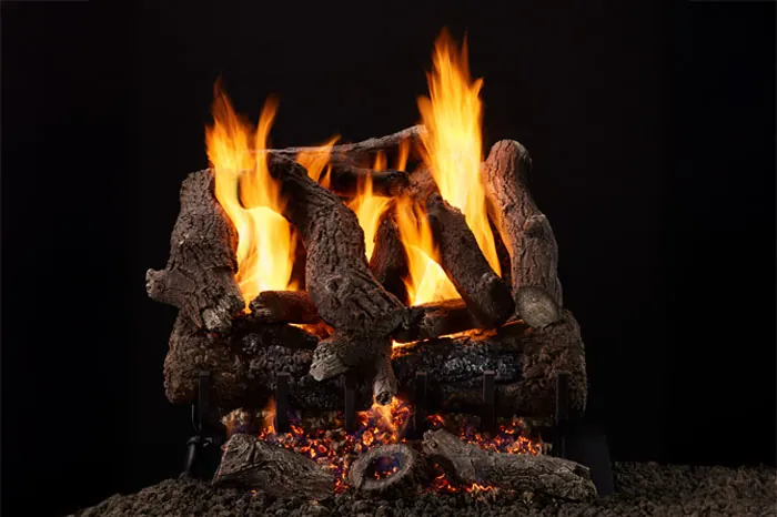 Heritage Oak 3-Tier Remote Control Gas Log Set with hand-painted oak logs, glowing ember bed, and tall flames against a black background.